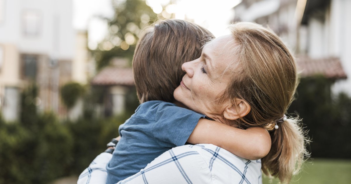 close-up-woman-hugging-kid